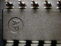 A grey part is showing with an indent with the letters AP inside
